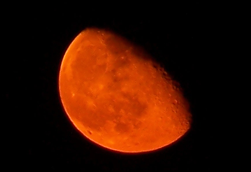 orange red moon over san antonio in september 